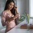 young-woman-using-phone-while-sitting-table_1048944-232801 young-woman-using-phone-while-sitting-table_1048944-232801